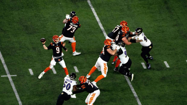 Cincinnati Bengals quarterback Joe Burrow (9) throws a pass in the first quarter of an NFL wild-card playoff football game between the Baltimore Ravens and the Cincinnati Bengals, Sunday, Jan. 15, 2023, at Paycor Stadium in Cincinnati. Baltimore Ravens At Cincinnati Bengals Afc Wild Card Jan 15 595